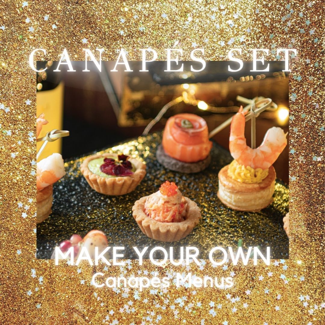 Canapés Catering set with various toppings, arranged on a dark surface and gold glitter background.