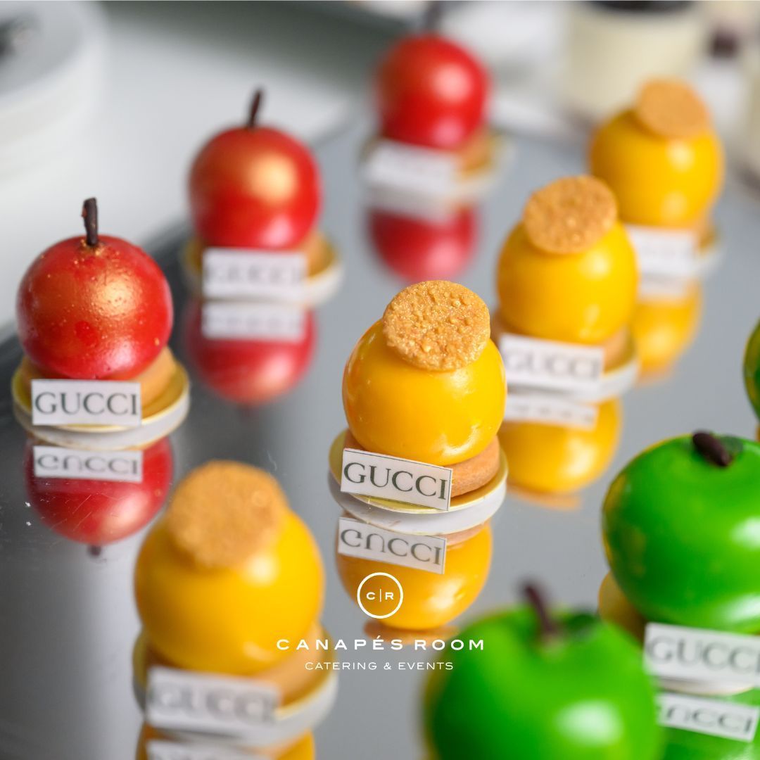 Mini desserts shaped like apples, labeled
