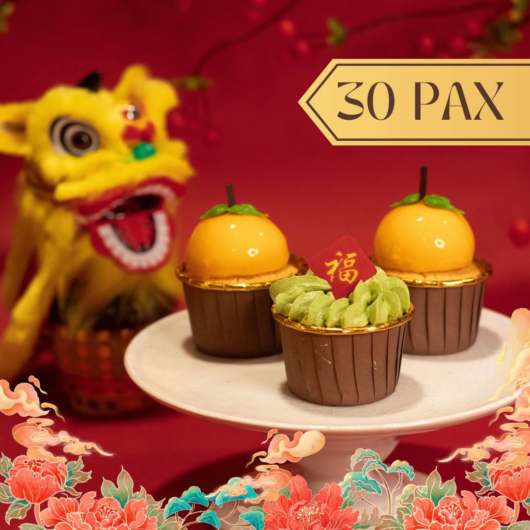 Lunar New Year cupcakes with orange tops, on a cake stand, with a lion dance head.