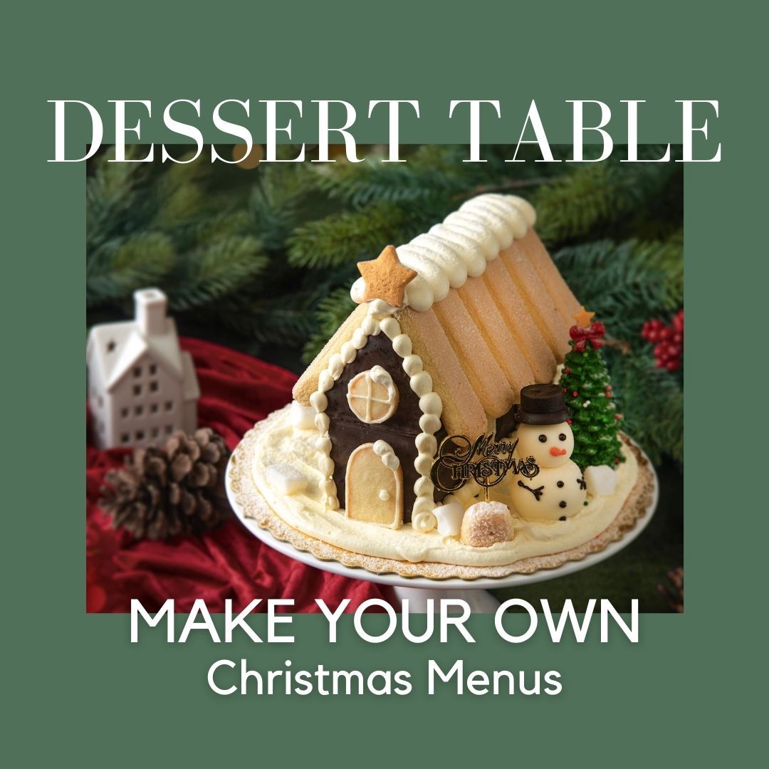Christmas dessert display with a gingerbread house, a snowman, and text.