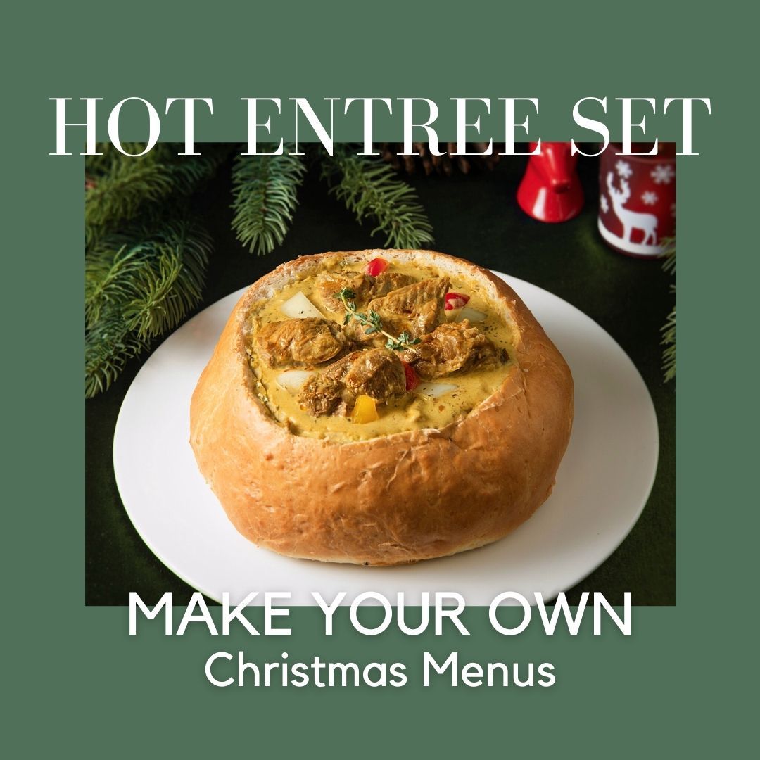 Hot entree set served in a bread bowl, Christmas menu promotion.