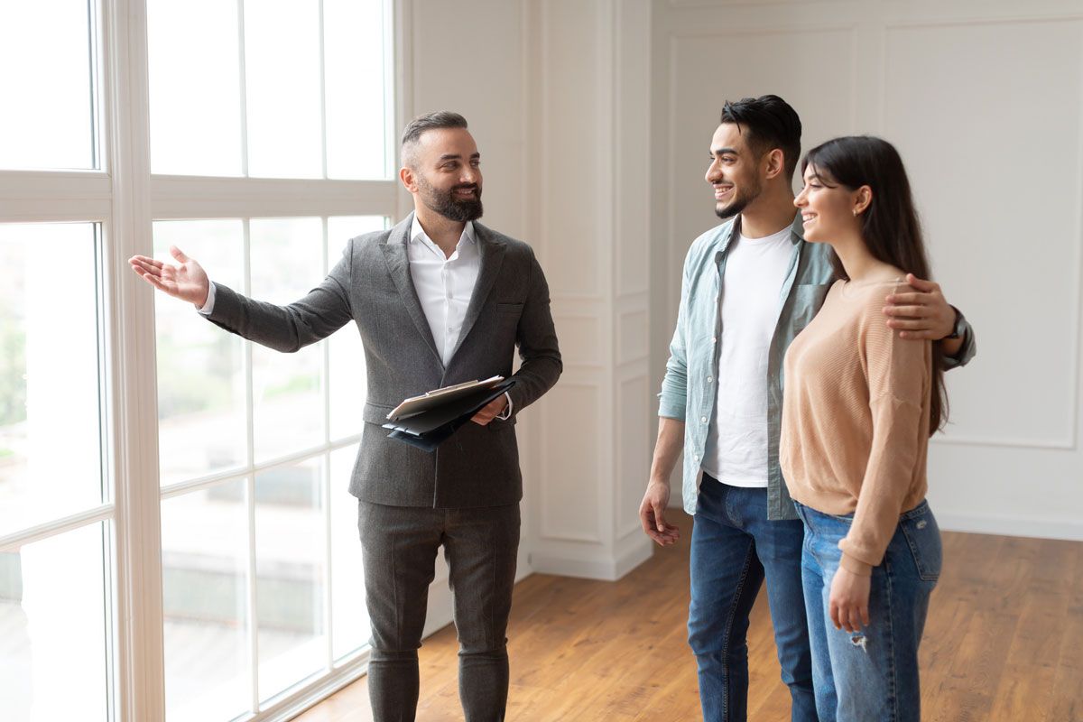 Photo of Real Estate Agent Showing a House