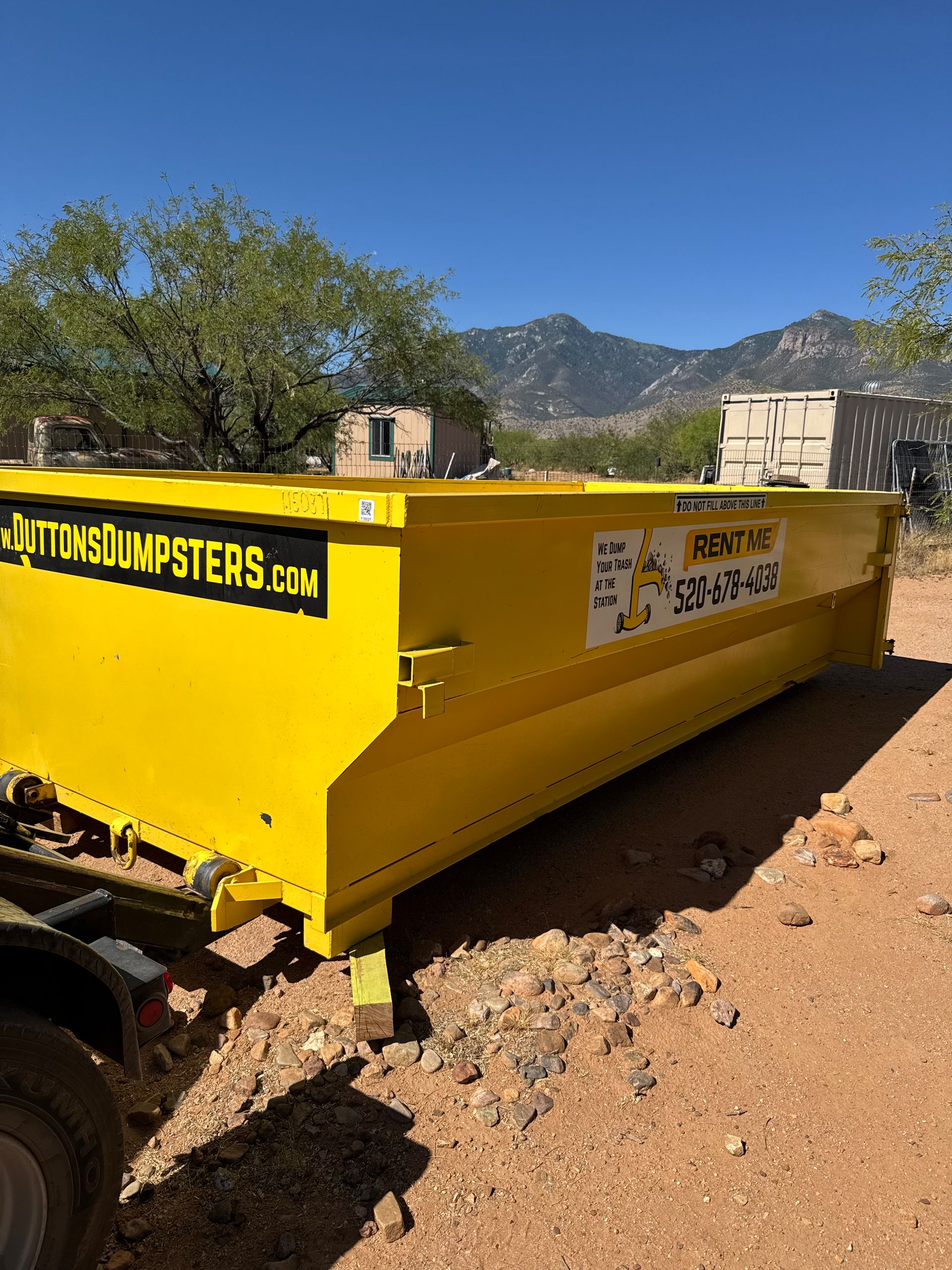 11 yard roll-off dumpster from Dutton's Dumpsters