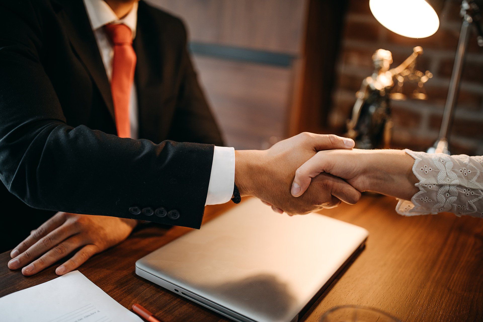 Lawyer And A Woman Hand Shake — Jefferson City, MO — Reed Law Lawyer And A Woman Hand Shake — Jefferson City, MO — Reed Law