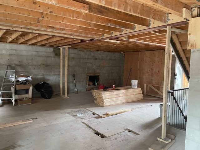 A room that is being remodeled with a hole in the wall.