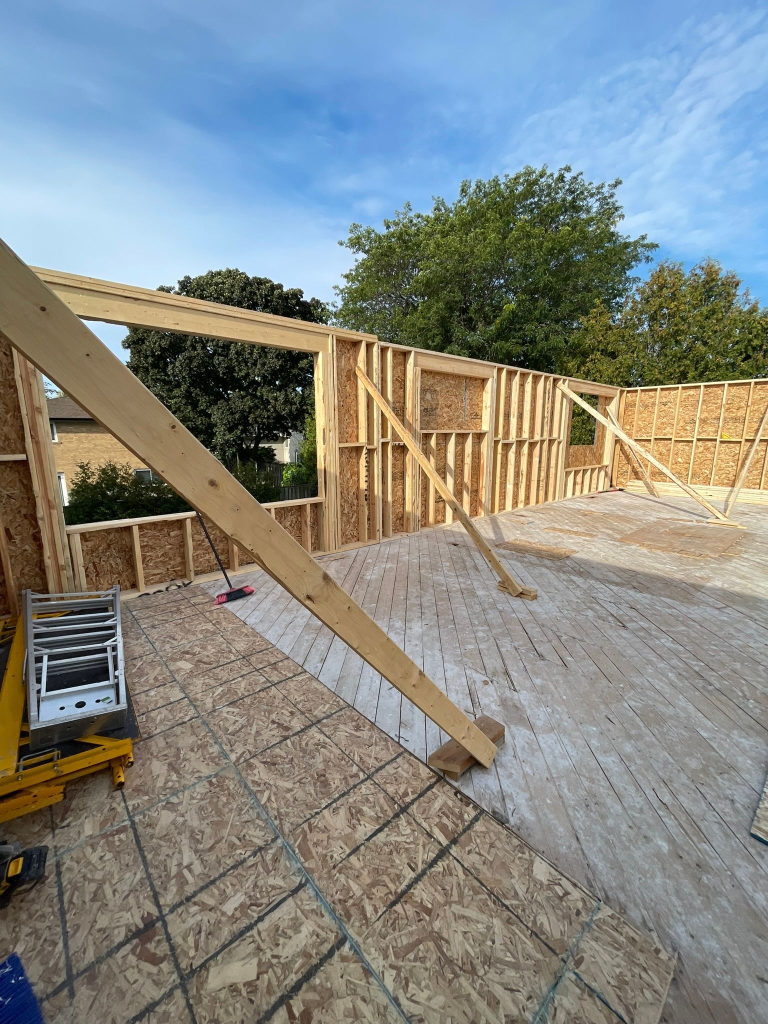 A wooden structure is being built on top of a tiled floor.