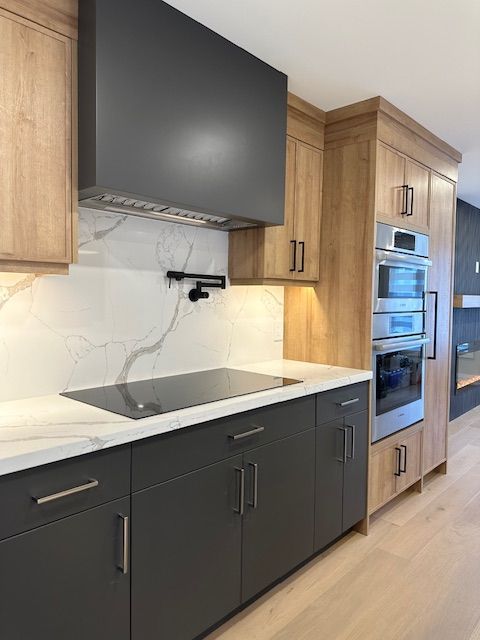 A kitchen with wooden cabinets and a stove top oven