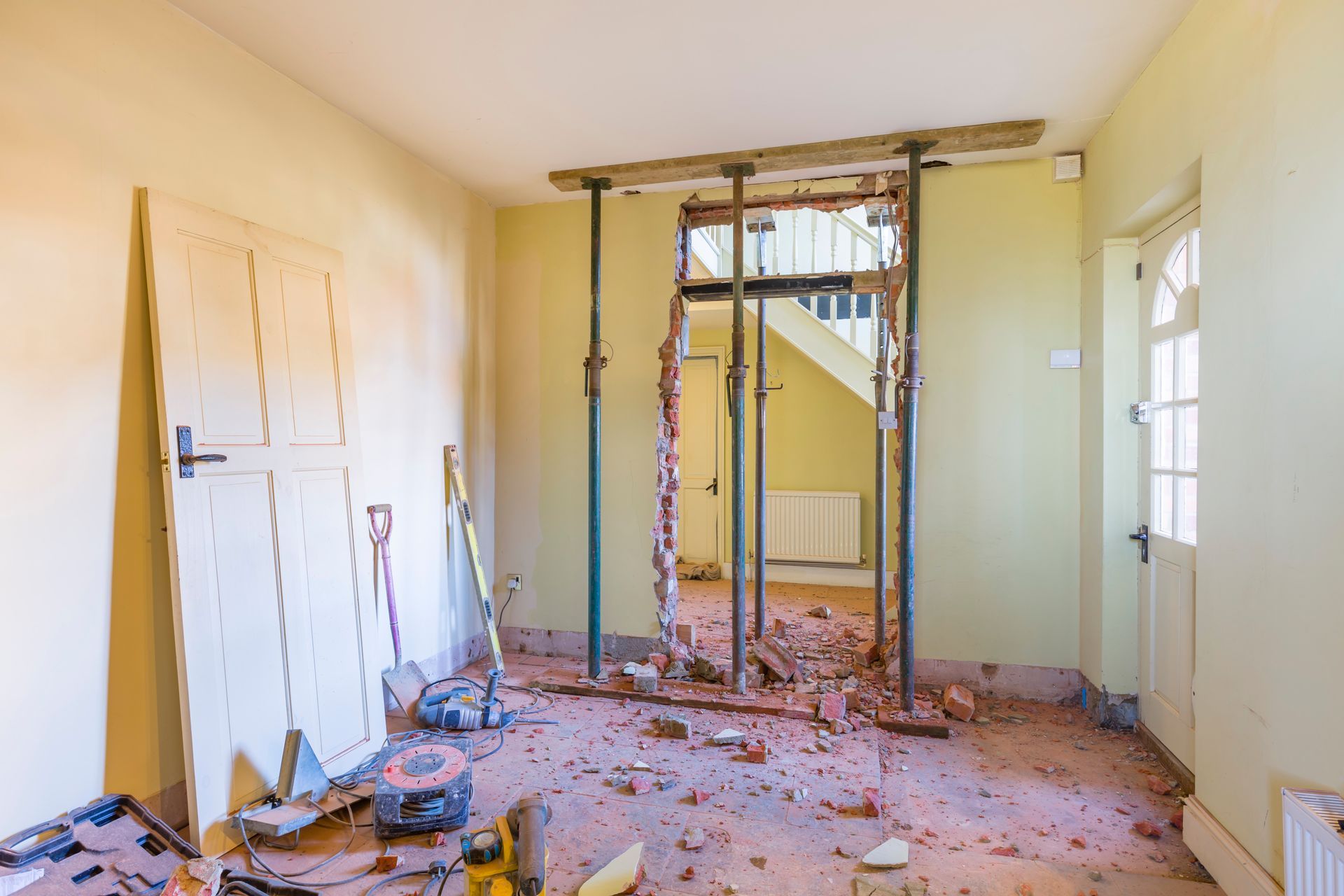 A room that is being remodeled with a hole in the wall.
