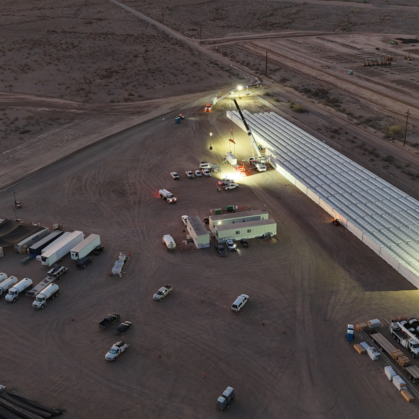 594 Tesla Megapack battery units staged and unloaded at a large-scale energy storage project in Tono