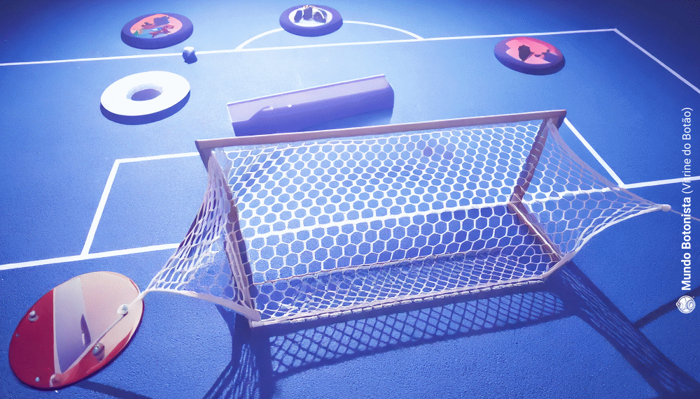 A blue soccer field with a goal and a net