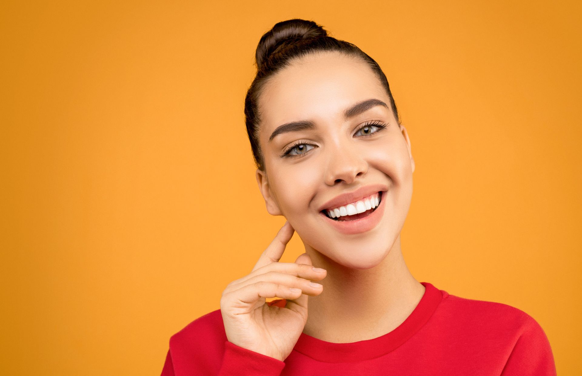 Smiling adult with bright healthy teeth after cosmetic dentistry for a younger look