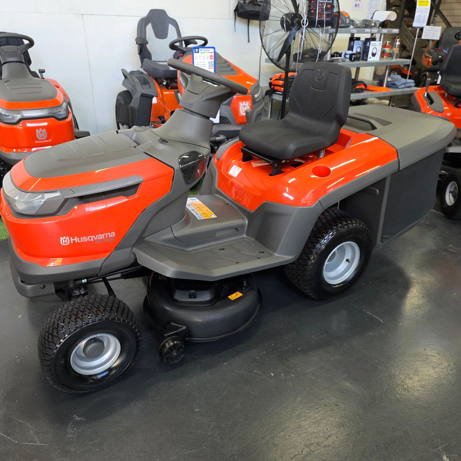 A Bright Orange Husqvarna Riding Lawn Mower — Tuggerah Outdoor Power in Tuggerah, NSW