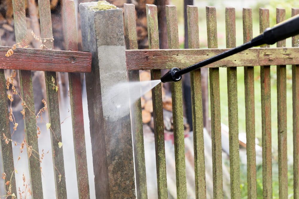 A High-pressure Washer Sprays Water Onto a Moss-covered Concrete — Tuggerah Outdoor Power in Tuggerah, NSW