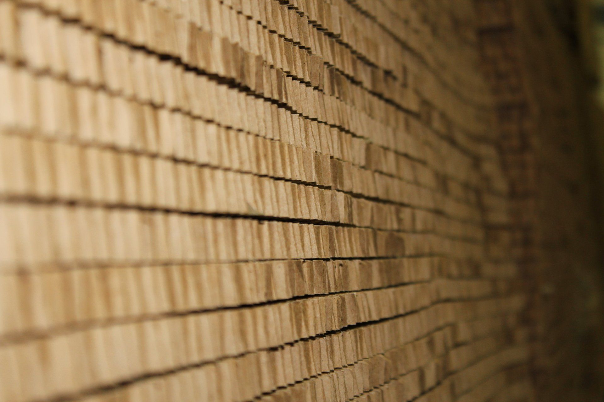 A large wall of wooden materials stretching off into the distance.