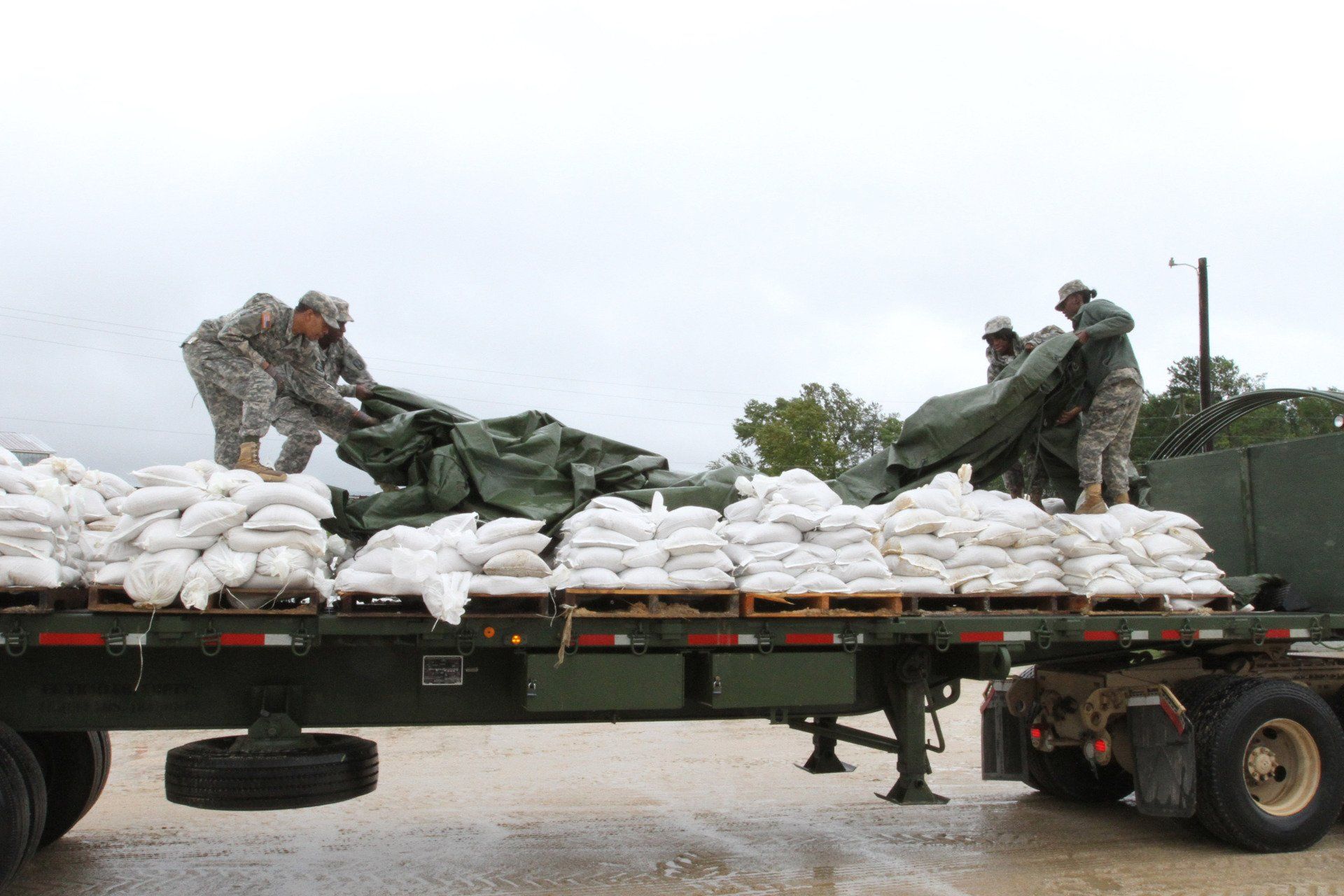 The national guard using sandbags to prepare for a hurricane.