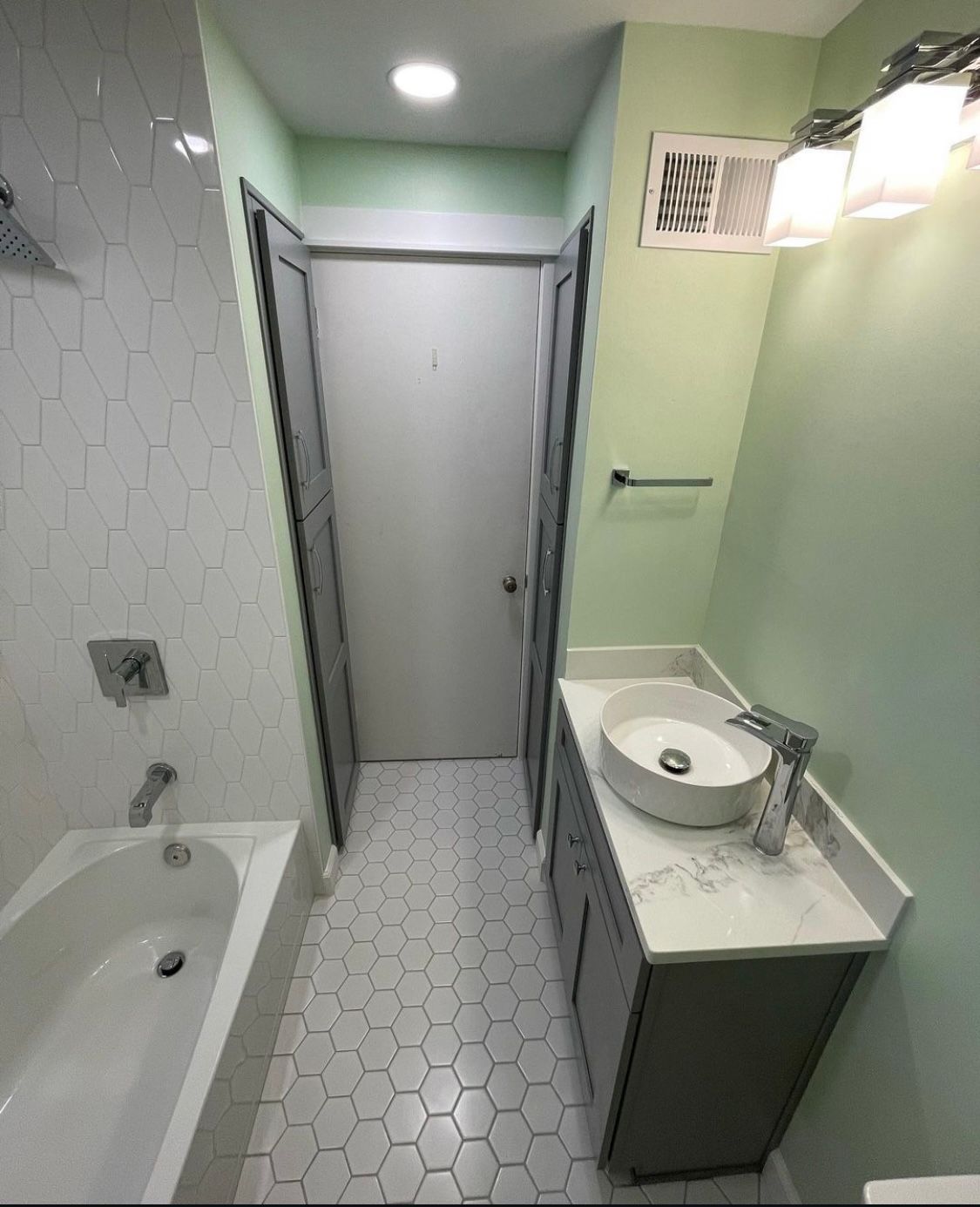 An image of a bathroom with green walls in Fairwood, WA