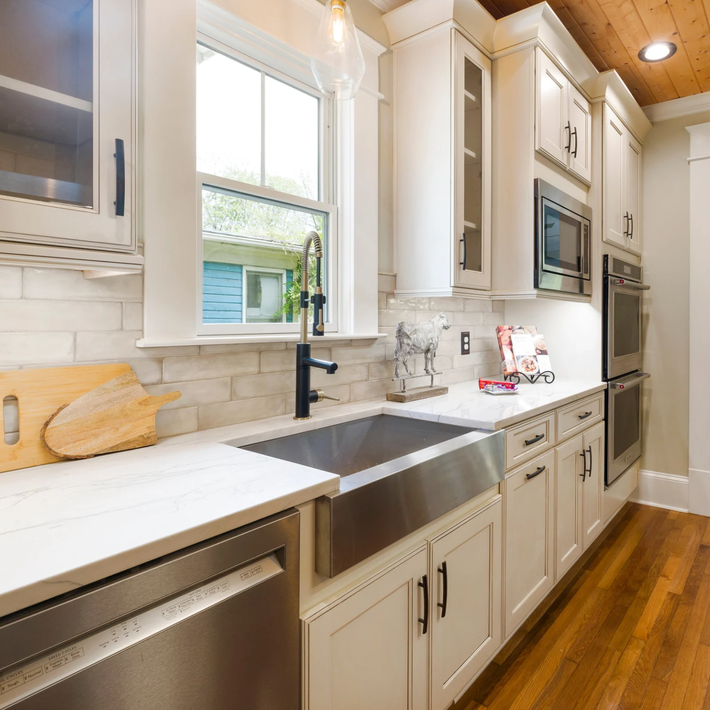 A kitchen with wooden cabinets and stainless steel appliances