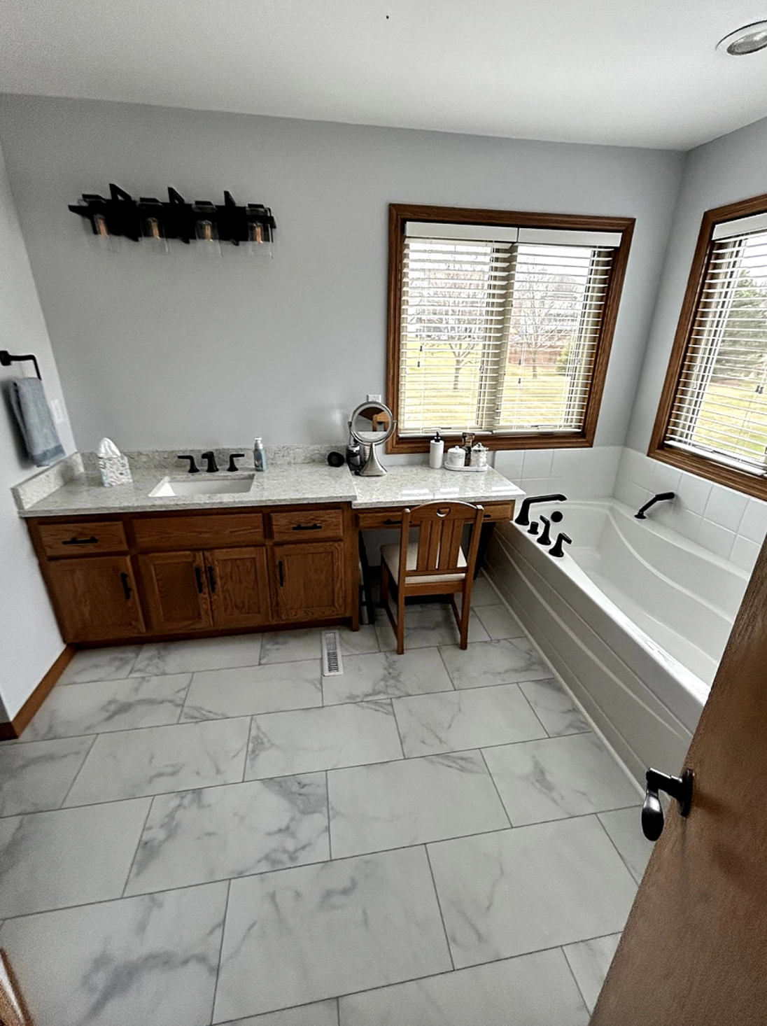 A kitchen with stainless steel appliances and wooden cabinets