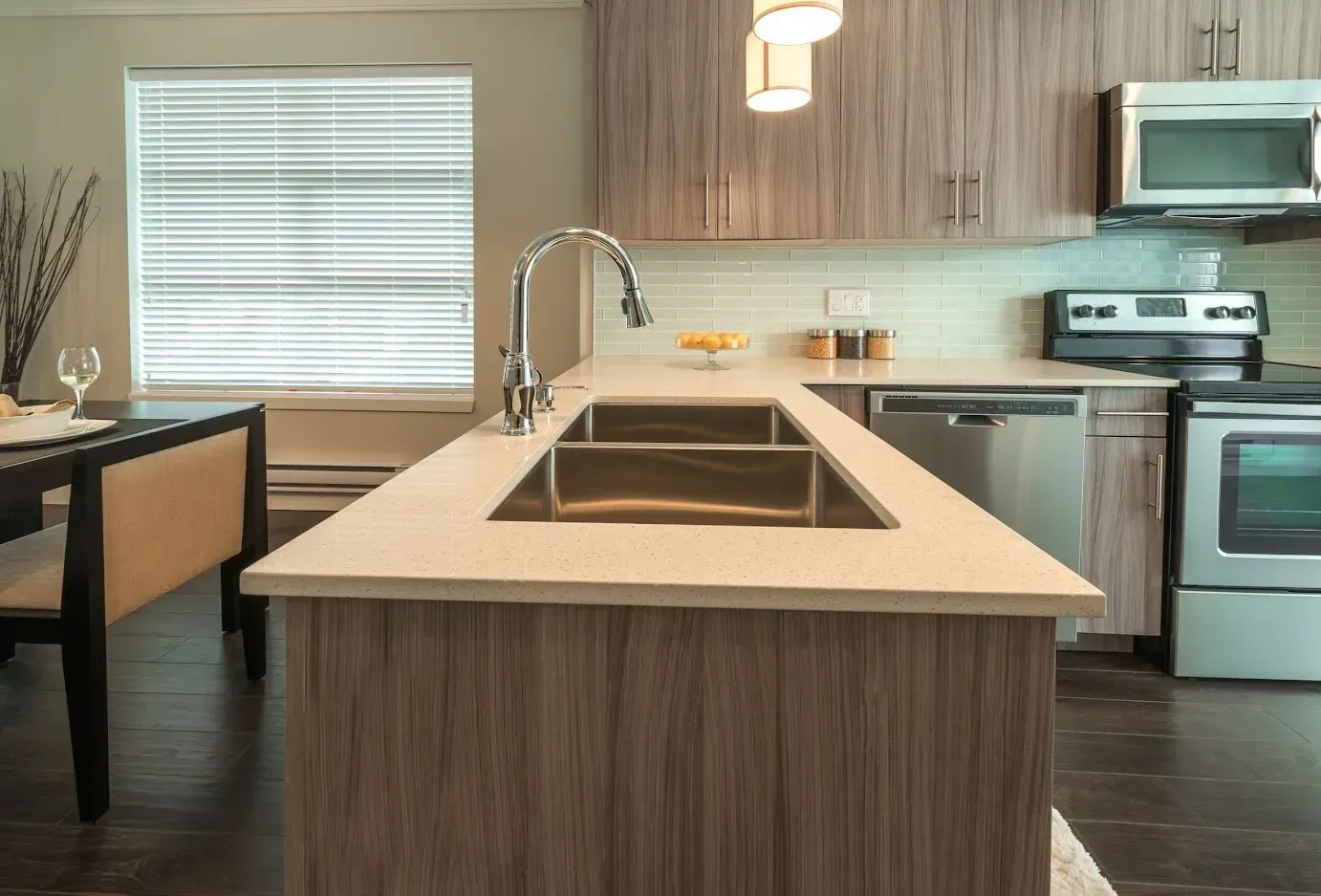 A kitchen with stainless steel appliances and wooden cabinets