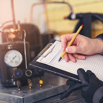 A technician in gloves taking notes on a clipboard next to industrial machinery. The scene is indoors, possibly a workshop.