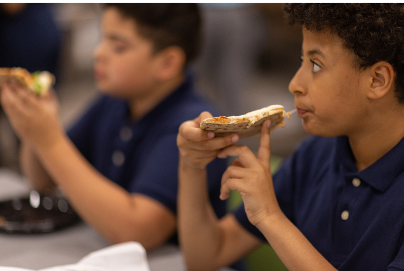 Child Eating Pizza