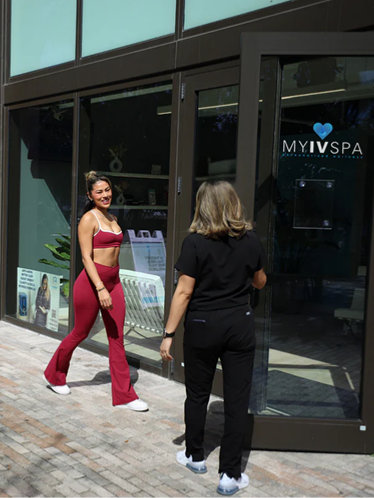 Woman in red activewear exits