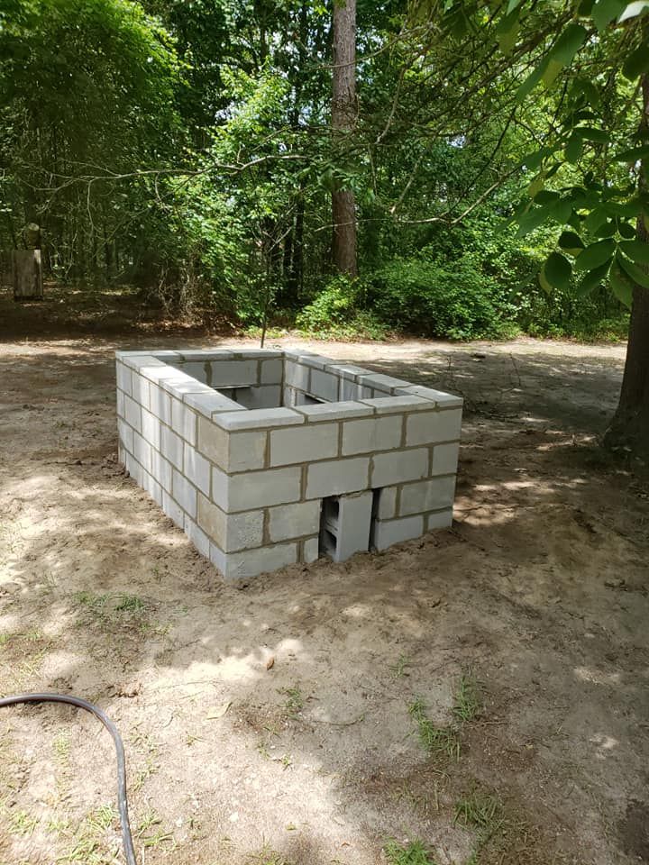 A fire pit is being constructed.