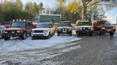 Three lifted vehicles inside the shop | Mountain European Auto Repair