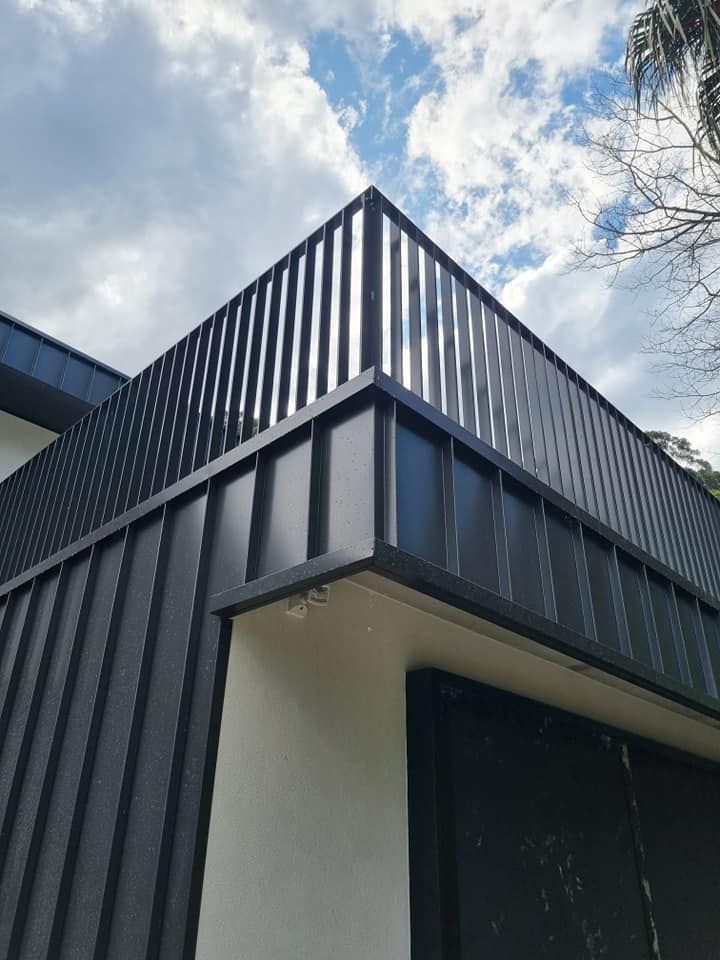 Black metal fence — D & T Balustrade Systems In Unanderra, NSW