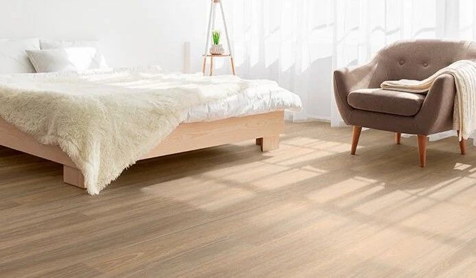 Modern bedroom with cream cover on a vinyl floor