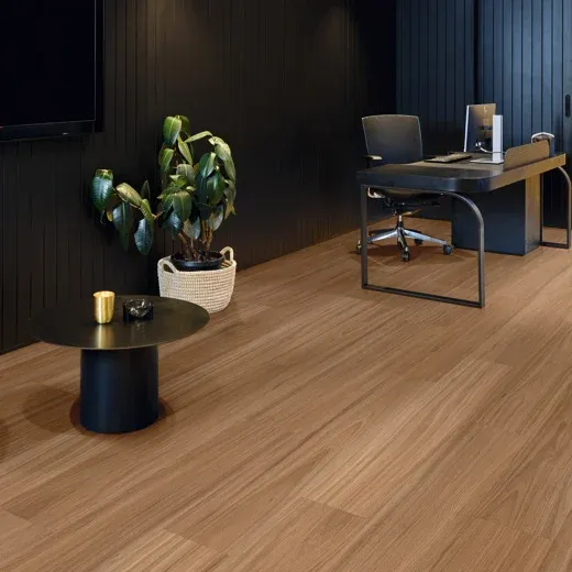 Hybrid flooring used in a very spacious office with a green plant in a basket