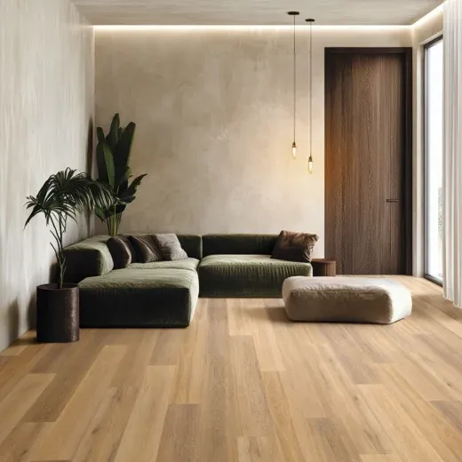 Low-hanging pendant lights and a green sofa on a light hybrid floor