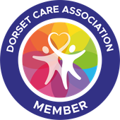Dorset Care Association Member logo with colorful circle and white figures holding a heart