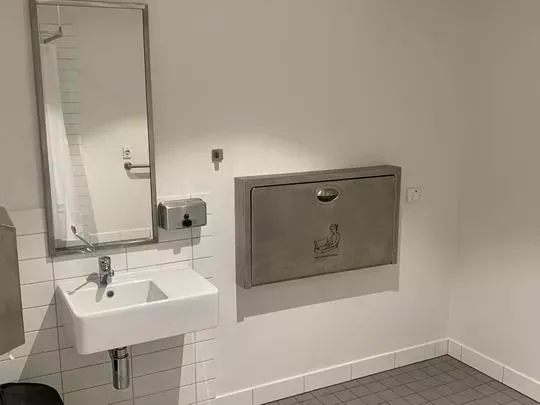 Disabled Toilet and Shower with a baby changing station.