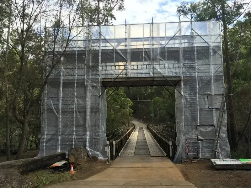 arch-like scaffolding on the entrance of a bridge