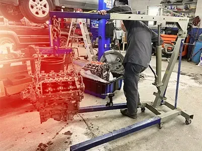 Engine lifted out of vehicle | KC Auto Solutions