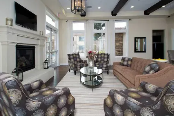 clubhouse photo showing a couch, chairs and television