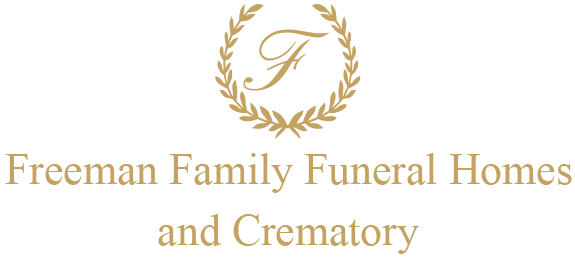 Logo for Freeman Family Funeral Homes and Crematory with a gold wreath and letter "F".