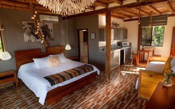 elegant room overlooking the ocean with a luxury feel. Suite with balcony