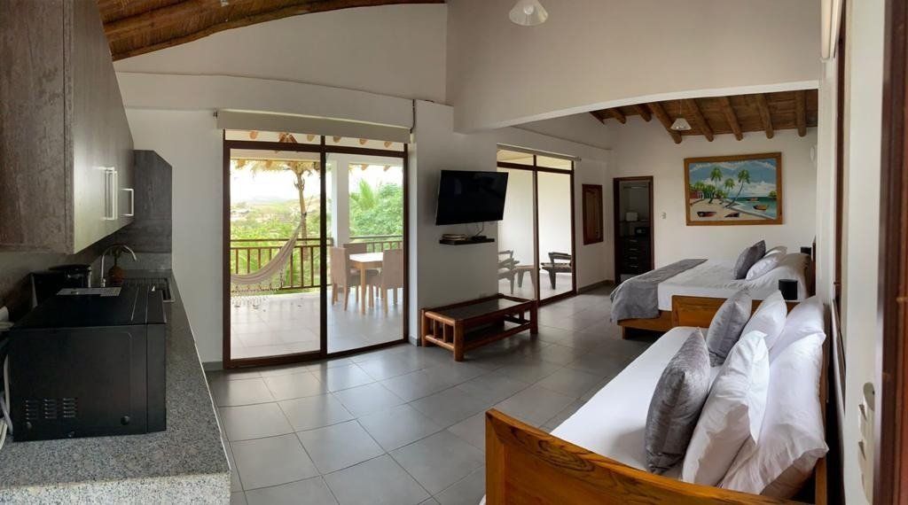 elegant room overlooking the ocean with a luxury feel. Suite with balcony