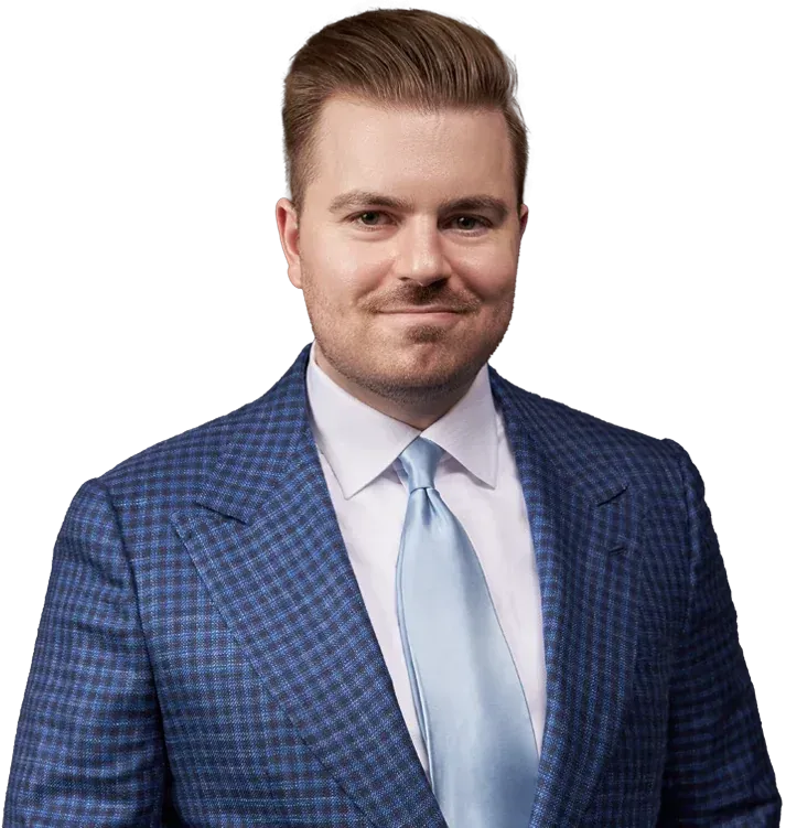 Portrait of a man in a blue checkered suit and light blue tie on a white background