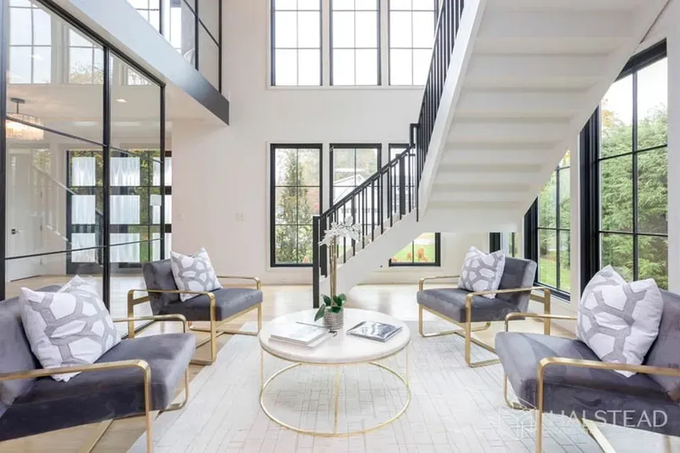 There is a staircase in the middle of the living room.