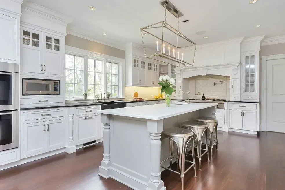 There is a large island in the middle of the kitchen.