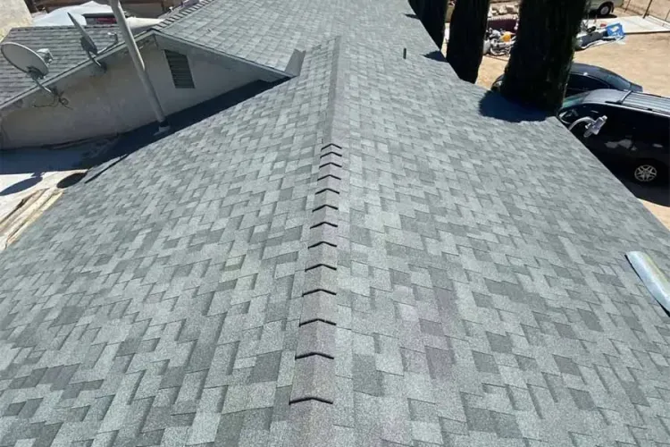 Gray shingle roof with ridge vent, viewed from above