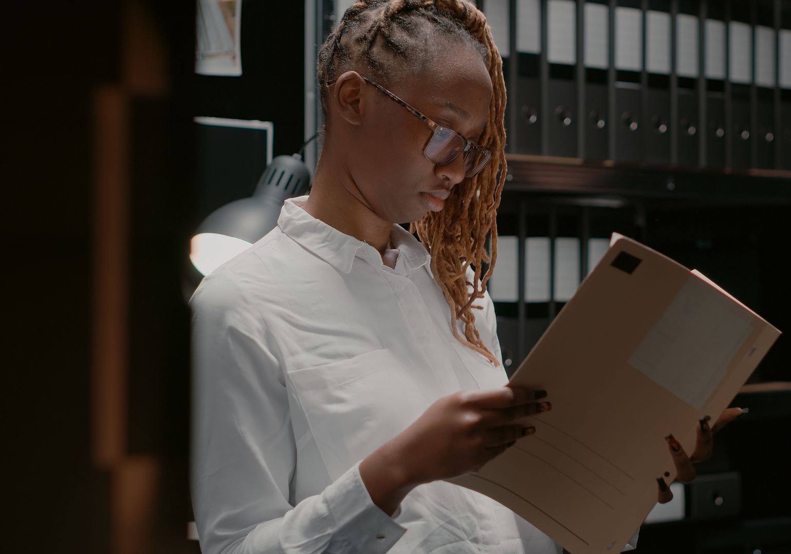 The same woman reads a case file, she now understands what is expungement