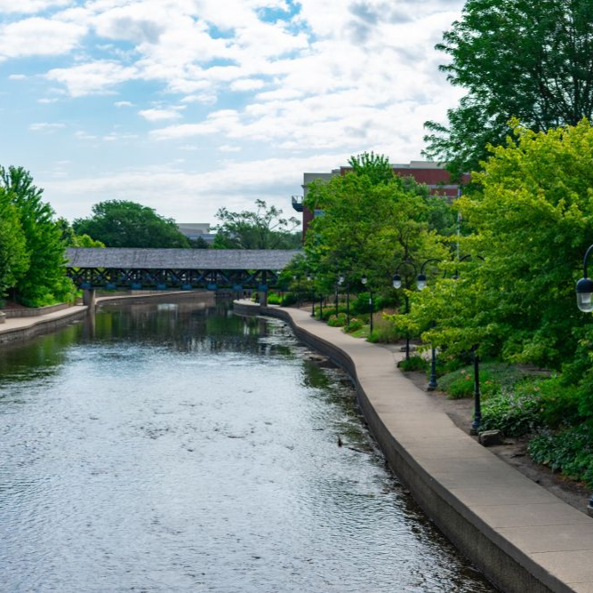 Covered Bridge in the Distance along the Naperville Riverwalk in Downtown Naperville