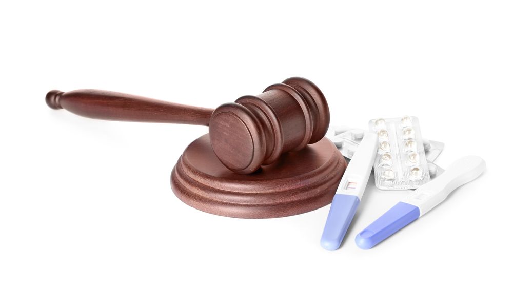 a gavel laying next to medication