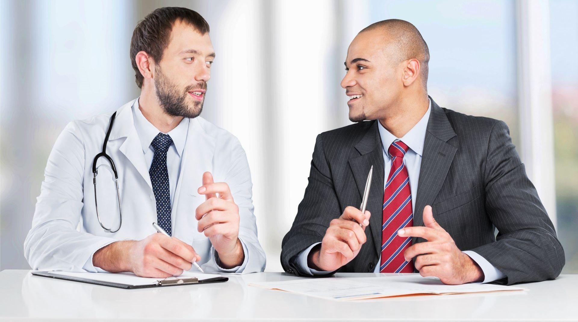A Doctor and an interviewing candidate speak with one another, the doctor would like to ask the question How can CRAs detect counterfeit healthcare diplomas?