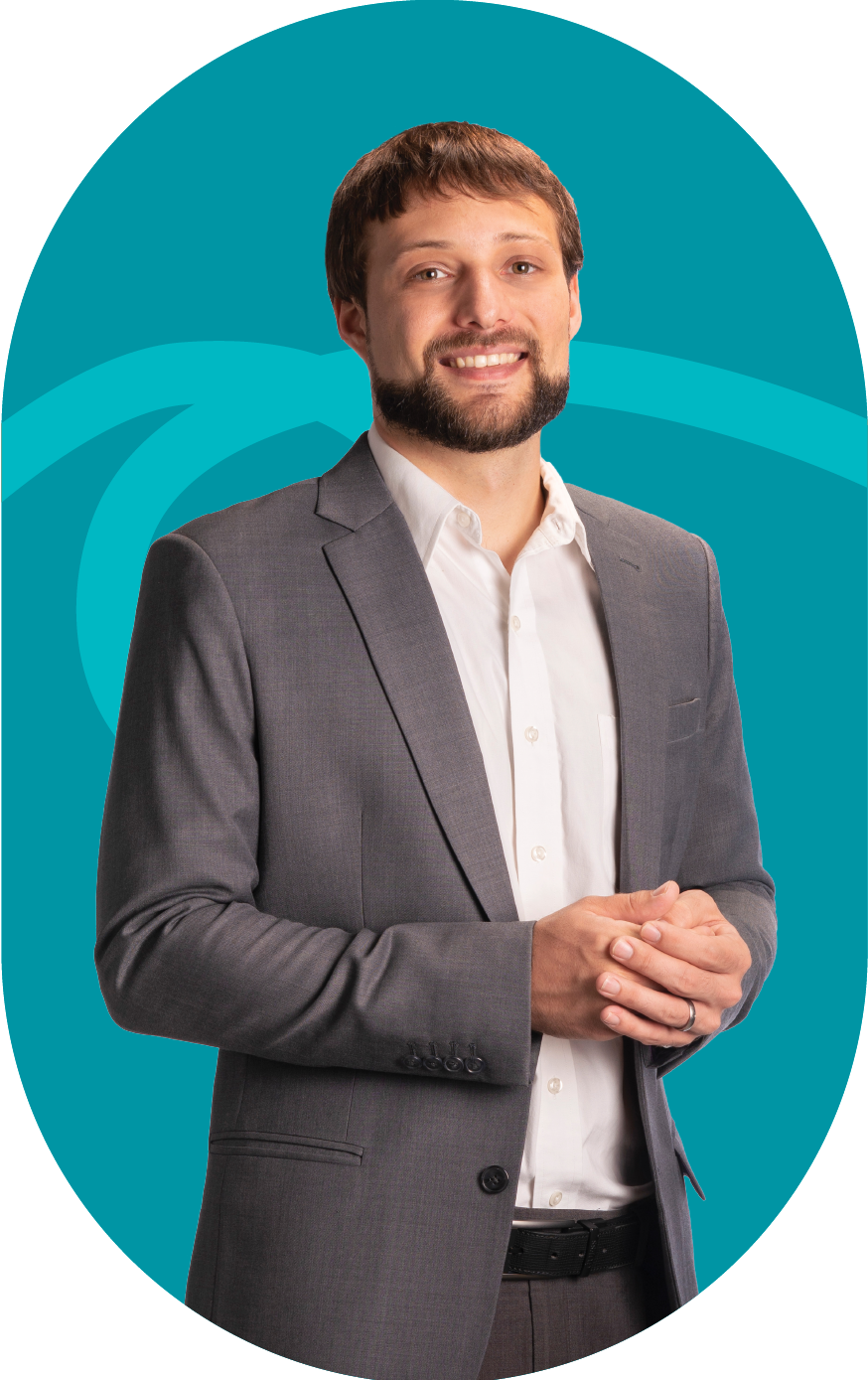 A man with a beard wearing a suit and white shirt