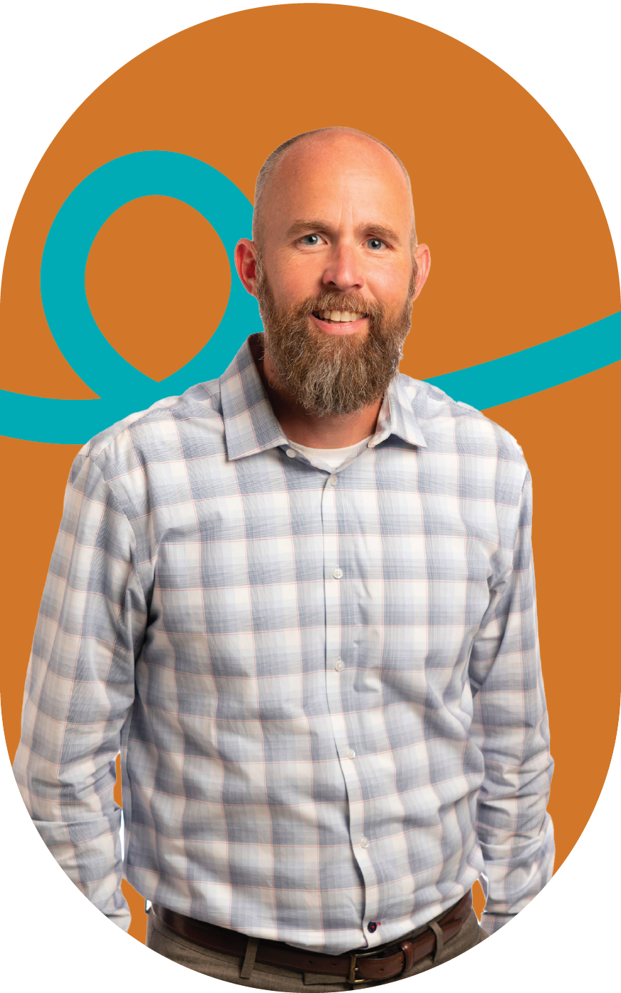 A man with a beard is wearing a plaid shirt and smiling.